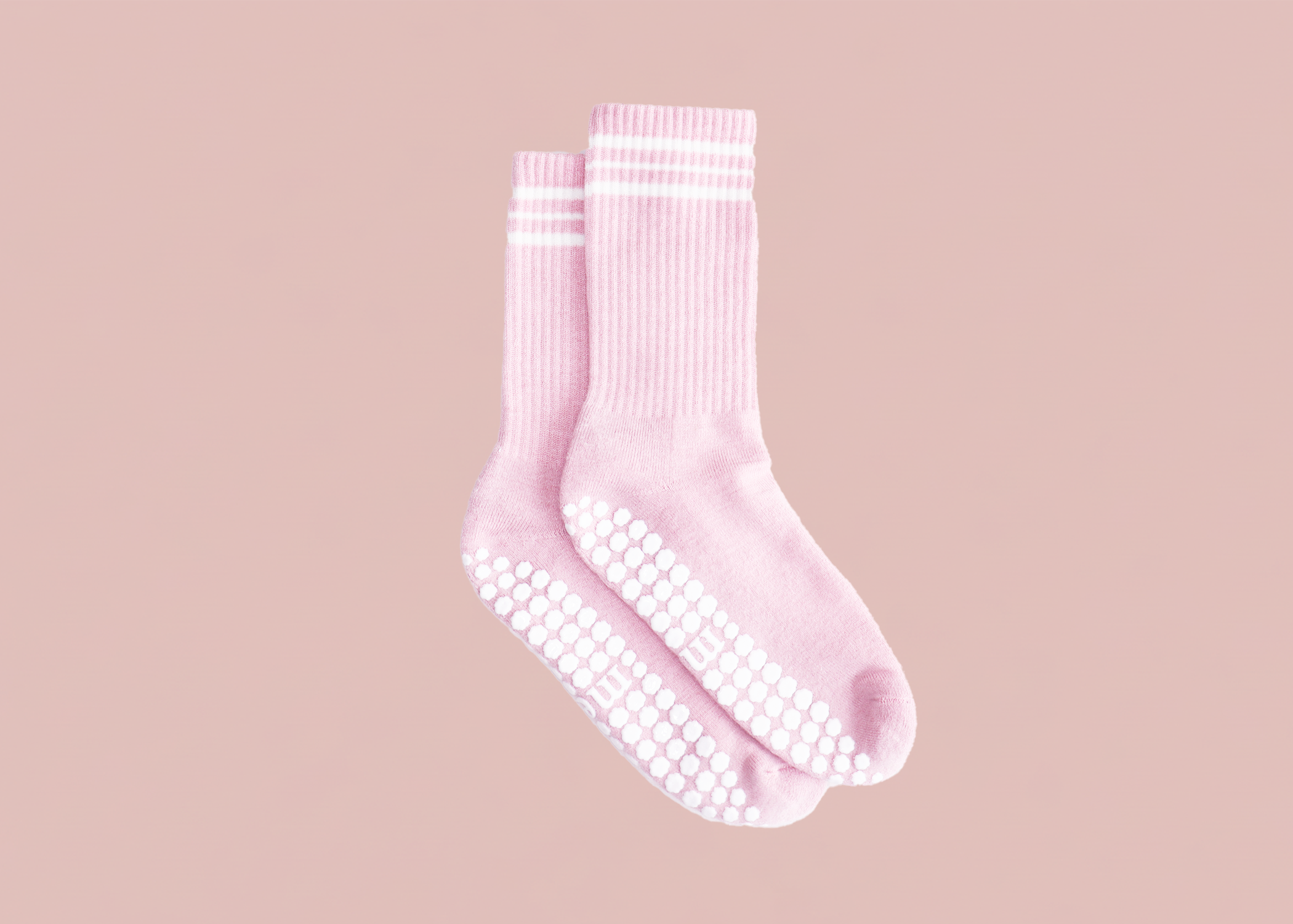 pink merino wool pilates grip sock with horizontal stripes detail and white grip pattern