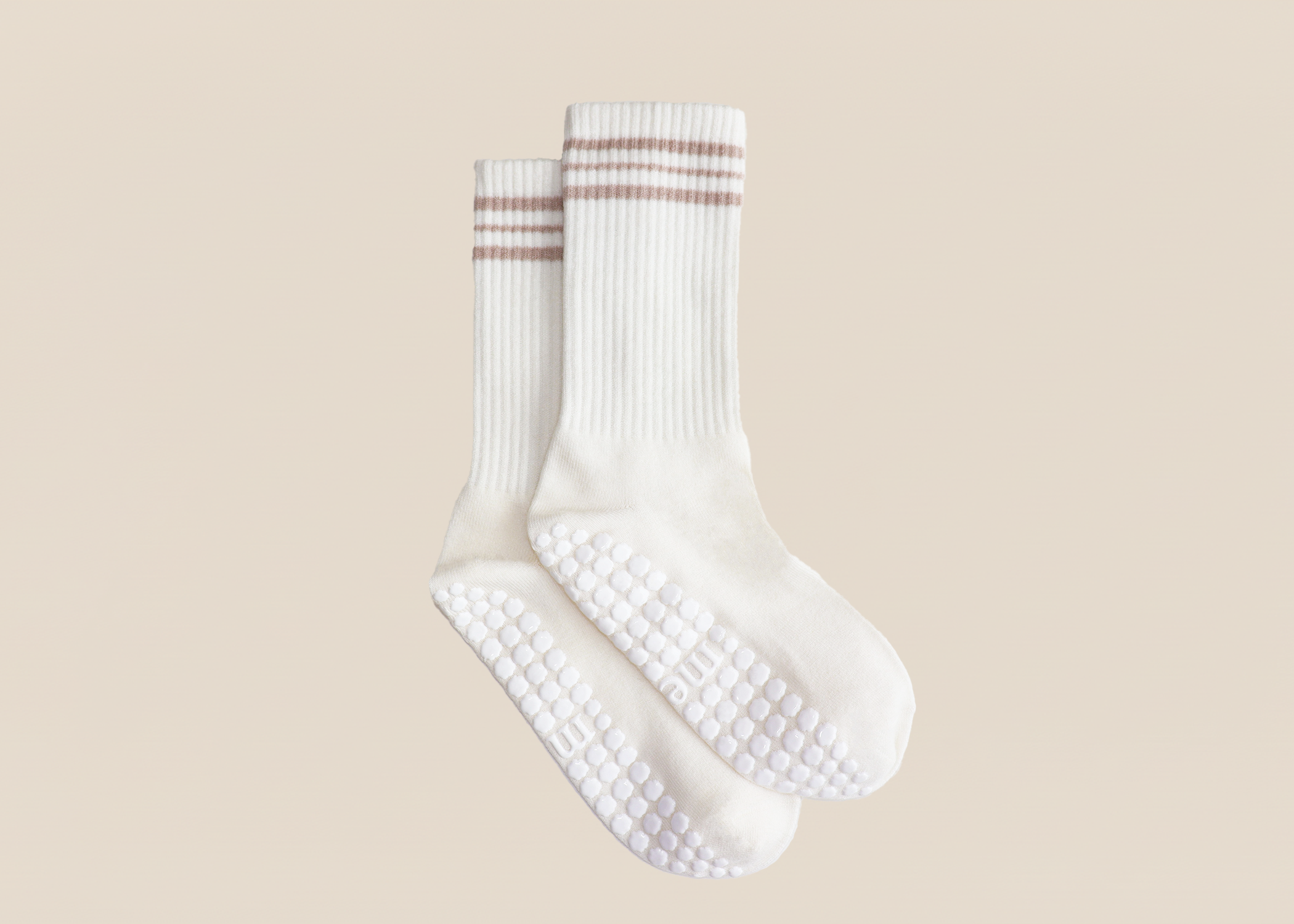 white merino wool pilates grip sock with horizontal stripes detail and white grip pattern